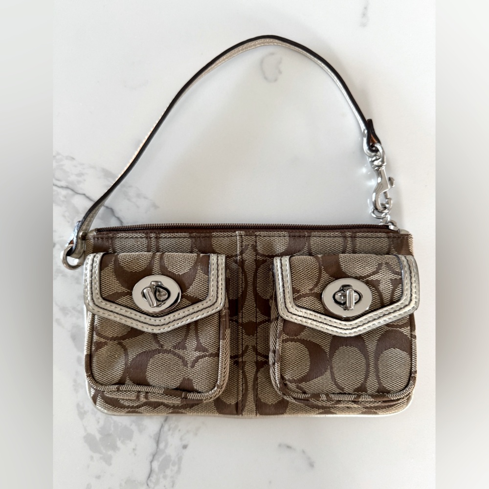 Authentic Coach wristlet  logo with twin pocket.